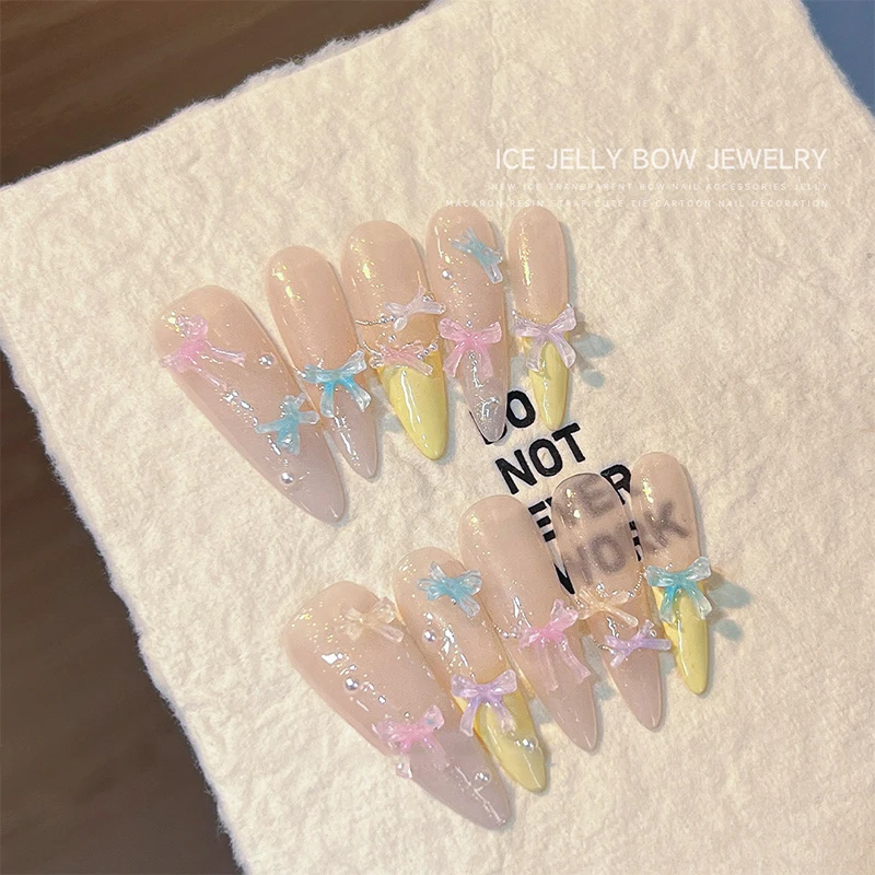 50Pcs Eis Transparente Farbe Bowknots Harz Nail art Dekoration 3D Mini Nette Bögen Nagel Charms Für DIY Nägel Kunst zubehör