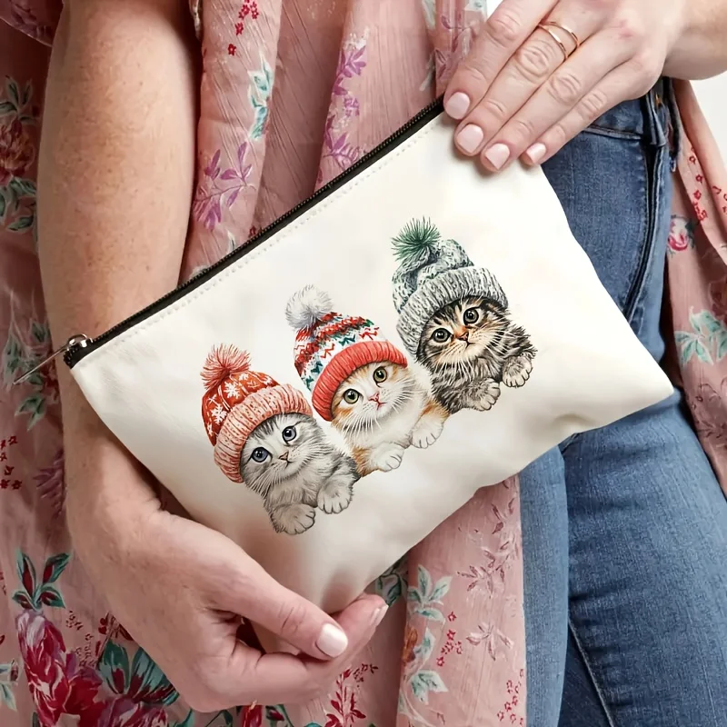 Zimowa kosmetyczka z motywem kociaka i kapelusza - urocza, wielofunkcyjna saszetka na zamek błyskawiczny, etui na biżuterię.