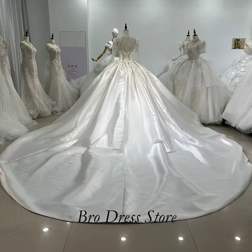 Customzied 2027 Luxury Satin Ball Gown Wedding Dress Long Sleeves V Neck Crystal Beaded Princess Bridal Gown Vestido De Novia