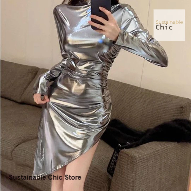 

Korean fashion long-sleeved new silver dress female spring and summer spice girl sexy fold waist slim glossy temperament skirt.