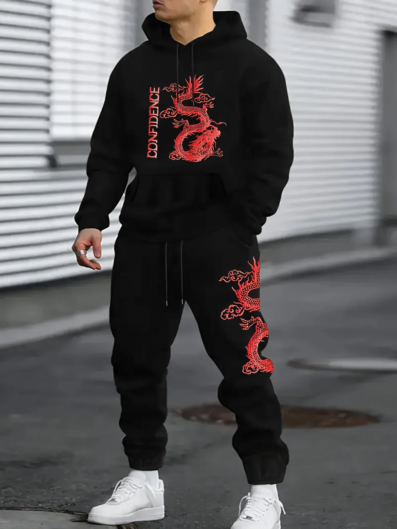 The man's casual letter-style red dragon printed hoodie and sports pants pair well with a fashionable autumn-winter outfit.