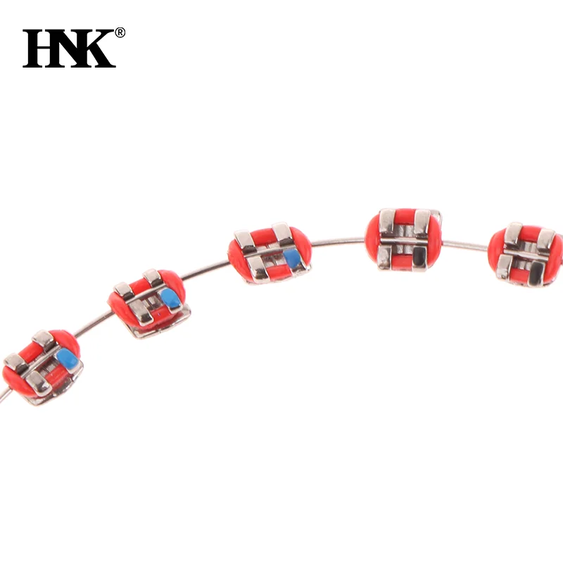 เครื่องประดับฟันชั่วคราวด้วยลวดโลหะ  ตัวยึดโลหะหลากสี และยางรัดจัดฟัน  ของตกแต่งทางทันตกรรม