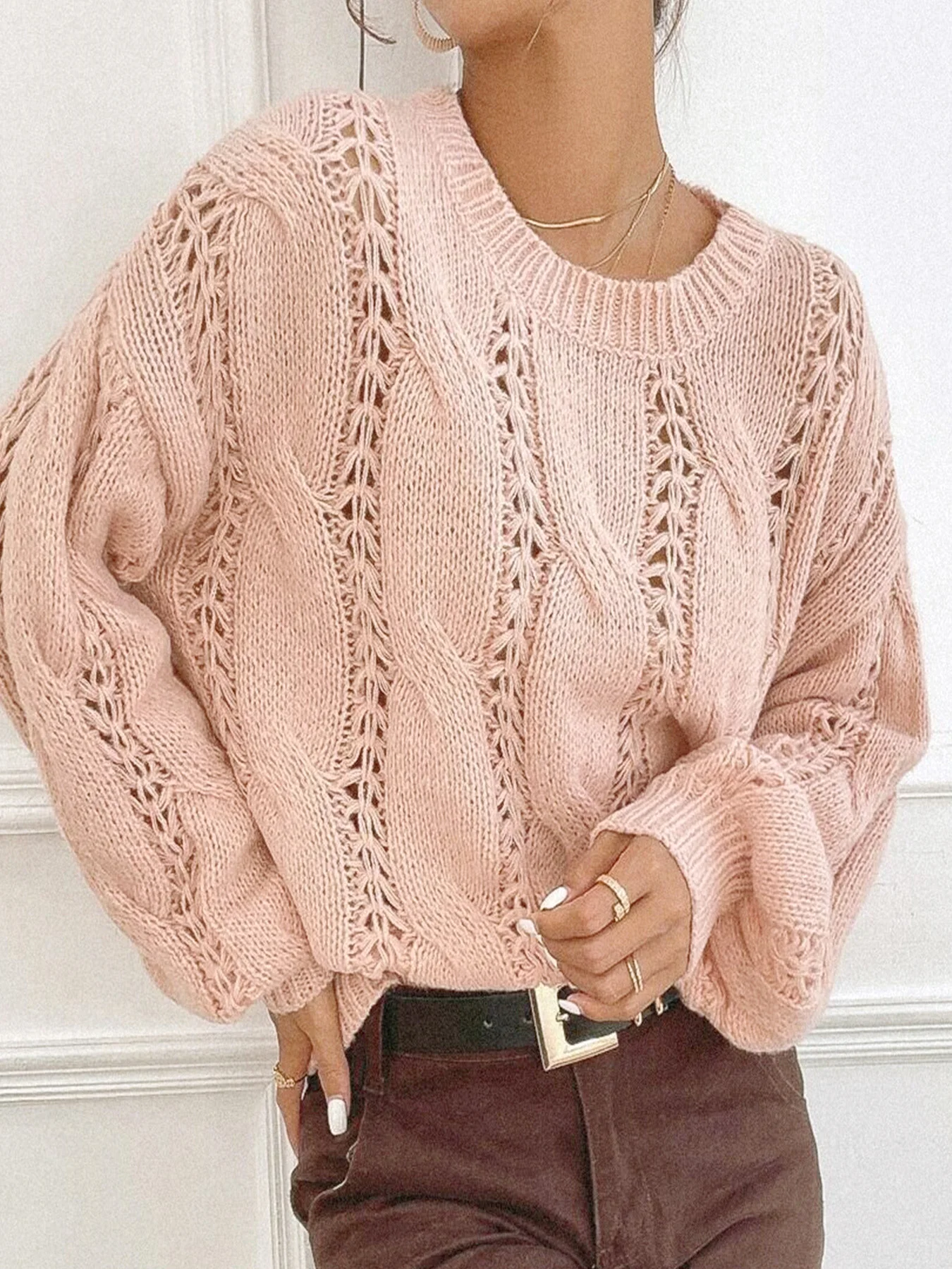 

Women's knitted sweater solid color round neck long sleeved hollow pullover sweater for spring and autumn