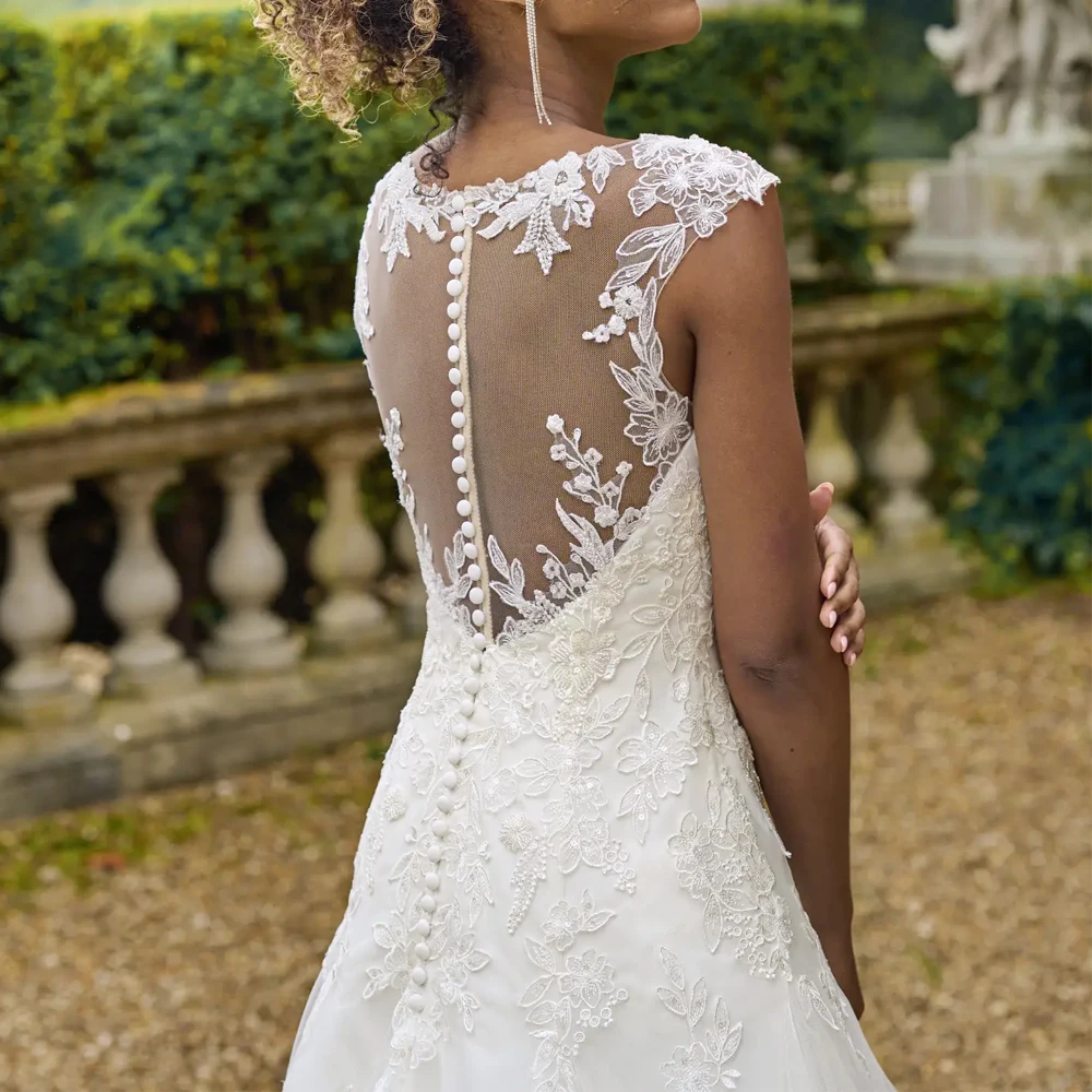 エレガントな V ネックのウェディングドレスワイドストラップブライダル成長アップリケレースイリュージョンカスタマイズ半袖 A ライン Vestidos デノビア