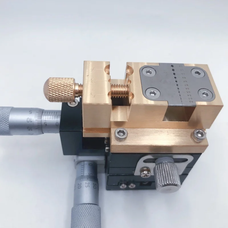 Special cross slide table for repairing table drills, capable of processing handle heads and punching holes