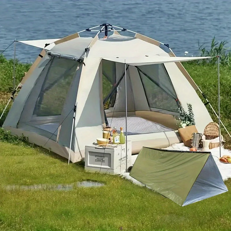 خيمة طوارئ مجهزة ببطانية عازلة خضراء متينة ومقاومة للبرد والمطر، مثالية للتخييم والأنشطة الخارجية