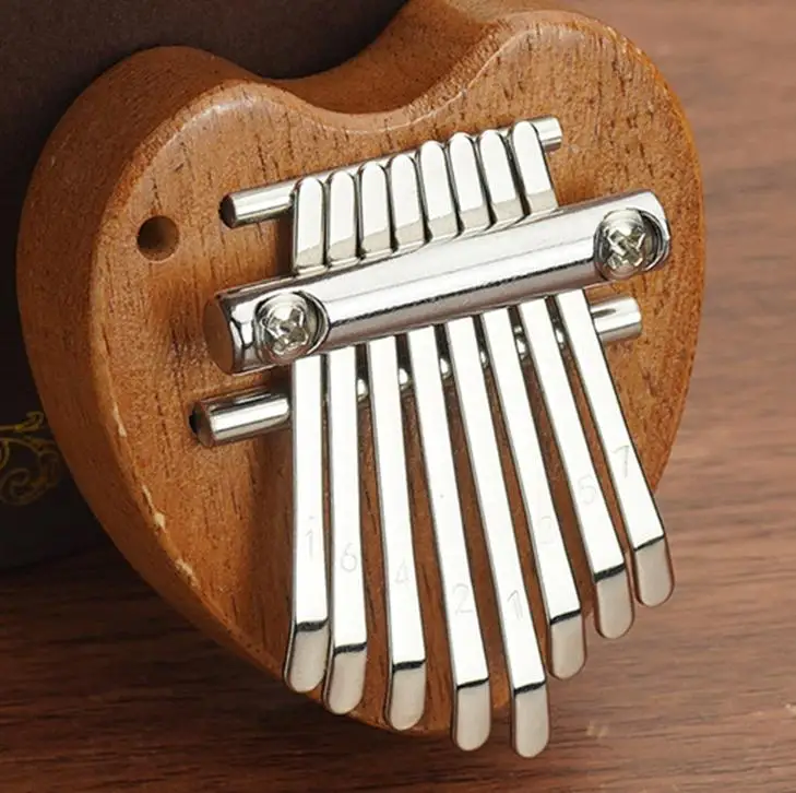 Mini Kalimba, Piano de pulgar de 8 teclas, 1 paquete, estilo gota de agua, instrumento bonito, juego de regalo exquisito portátil para niños