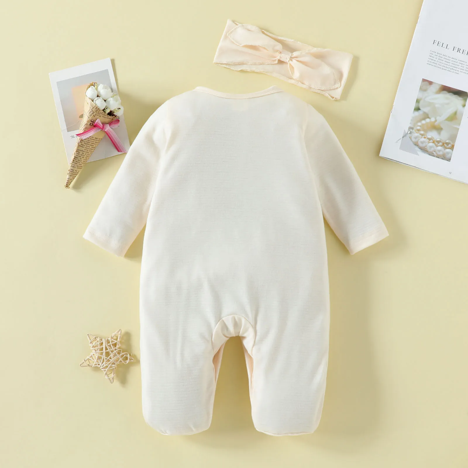 Newborn Light Apricot One-Piece Outfit with Diagonal Placket, Ruffled Edges, Foot Covers, and Matching Bow Headband