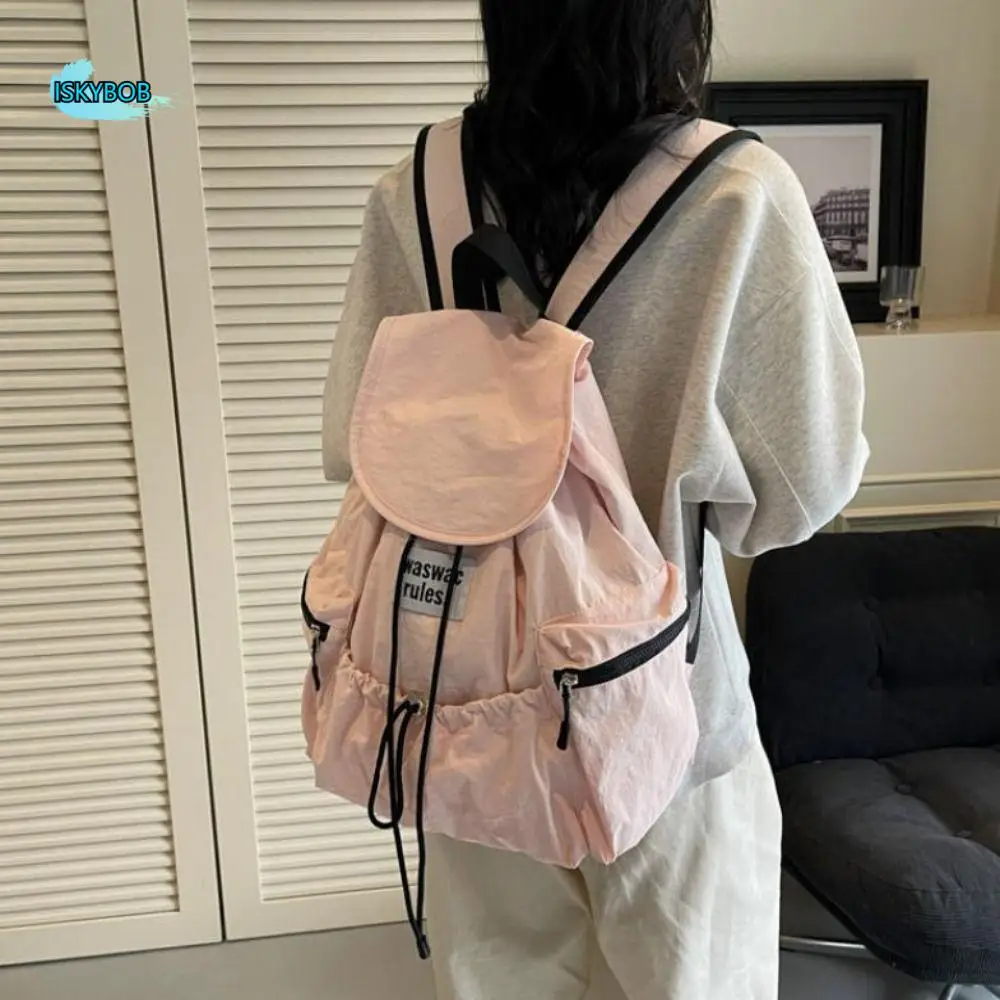 กระเป๋าเป้สะพายหลังแบบมีเชือกผูกสีพื้นสไตล์เกาหลี ทำจากไนลอน น้ำหนักเบา กระเป๋าสะพายไหล่แบบรูด จุของได้เยอะ เหมาะสำหรับนักเรียน นักศึกษา ใช้ได้ทั้งชายและหญิง