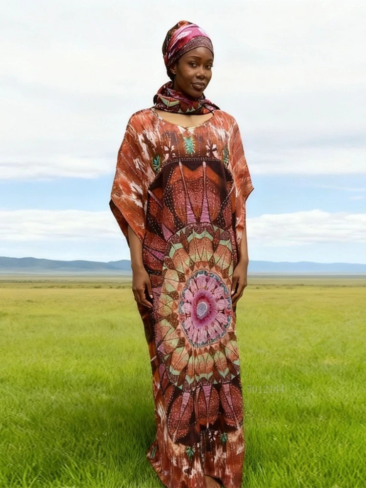 2026 Modieuze Afrikaanse vrouwen jurk rayon positionering hot boren afdrukken losse strand jumpsuit lange jurk groot formaat gewaad
