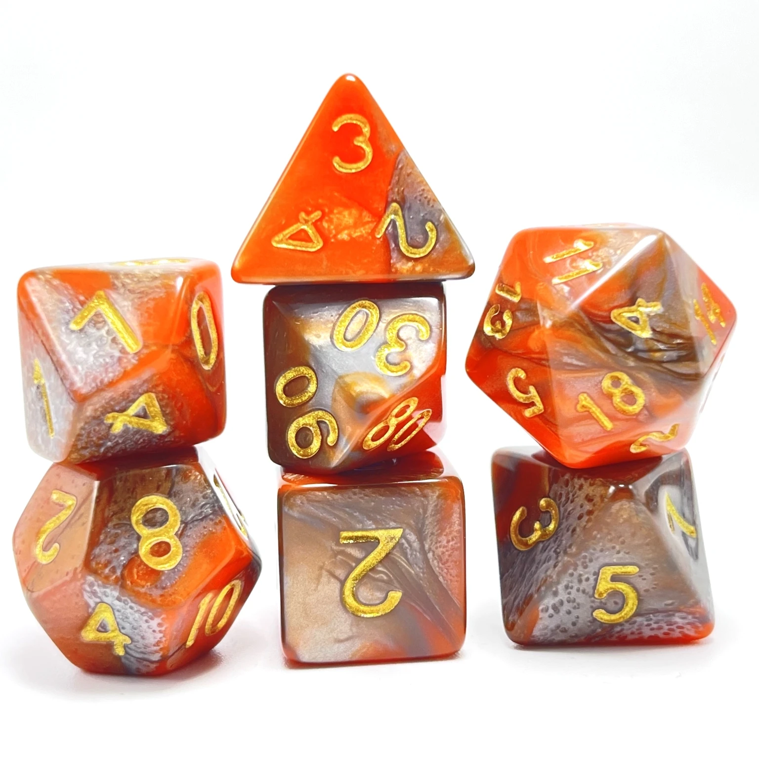 A set of 7 orange silver with gold lettering unleashing your inner warrior polyhedral dice game