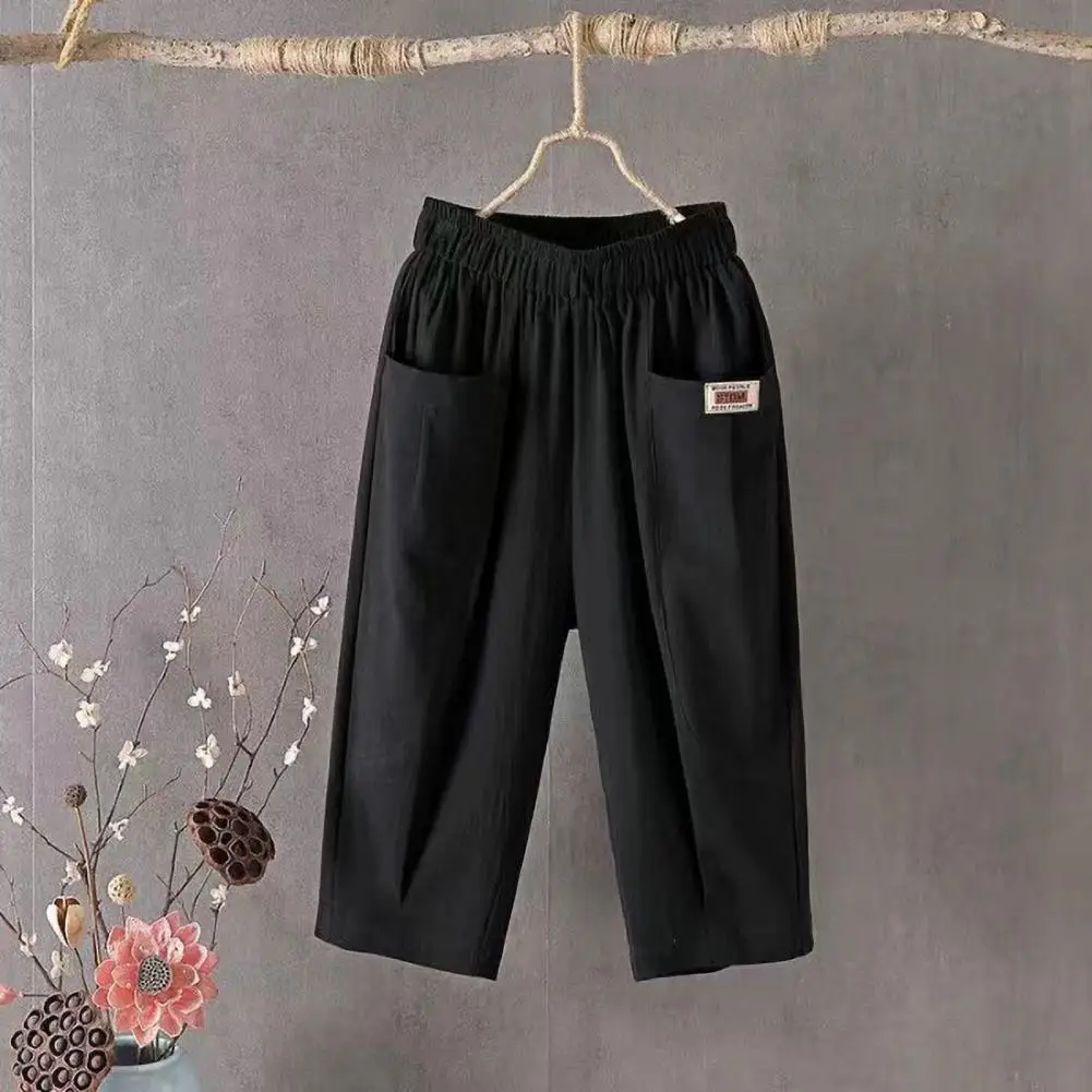 Calça recortada de verão feminina, cintura elástica, perna larga, calça casual, cor sólida, design de bolsos, calça harém