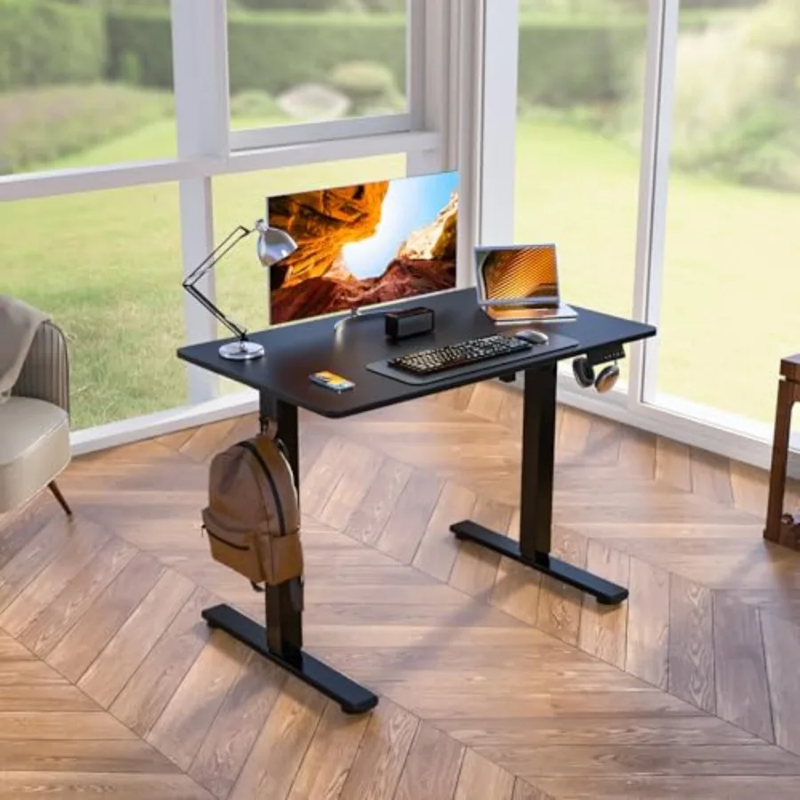 Standing Desk for home office, steel frame with black laminate top, smooth electric height adjustment from 28.5 to 47.5 inches