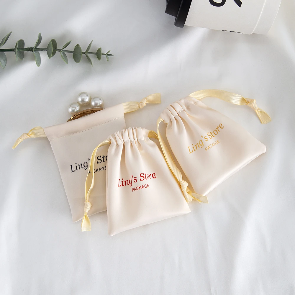

50Pcs Beige Silk Satin Jewelry Drawstring Gift Bag Print Logo Packaging Pouch for Rings Wedding Favors Guests Candy Personalized
