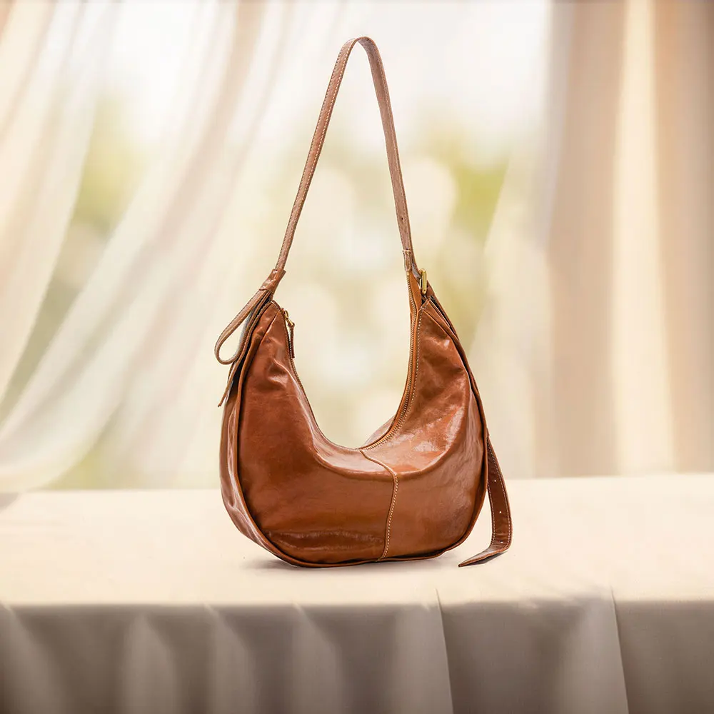 

2025 New Vegetable tanned Leather Underarm Bag for Women niche and high-end cow horn bag multifunctional women's crossbody bag