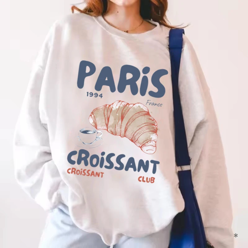 เสื้อสตรีลายกราฟิกวินเทจ ลายตัวอักษรปารีส ครัวซองต์ เสื้อสเวตเชิ้ตมีฮู้ด คอกลม แฟชั่น เสื้อผ้าผู้หญิง