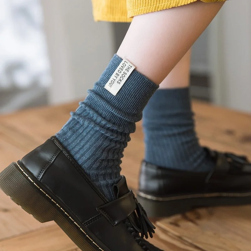 Calzini alti giapponesi della scuola delle ragazze del liceo di moda coreana tinta unita calzini larghi Beige kaki bianchi calzini lunghi da donna in maglia di cotone