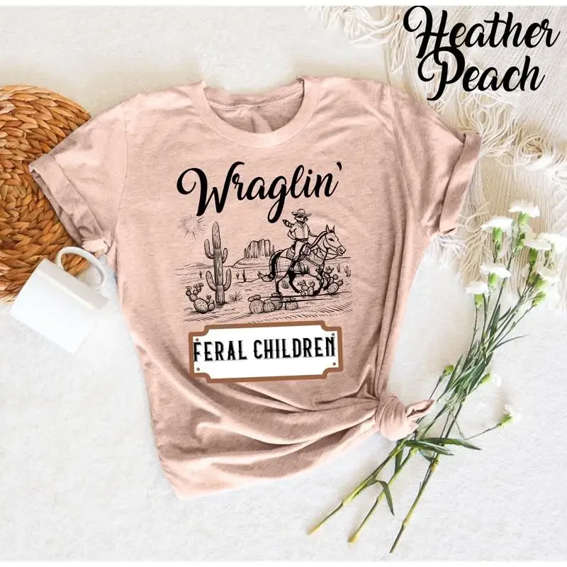 

Wranglin Feral Children 90s Western Cowboy T Shirt Funny Raccoon Quote Lover Humor