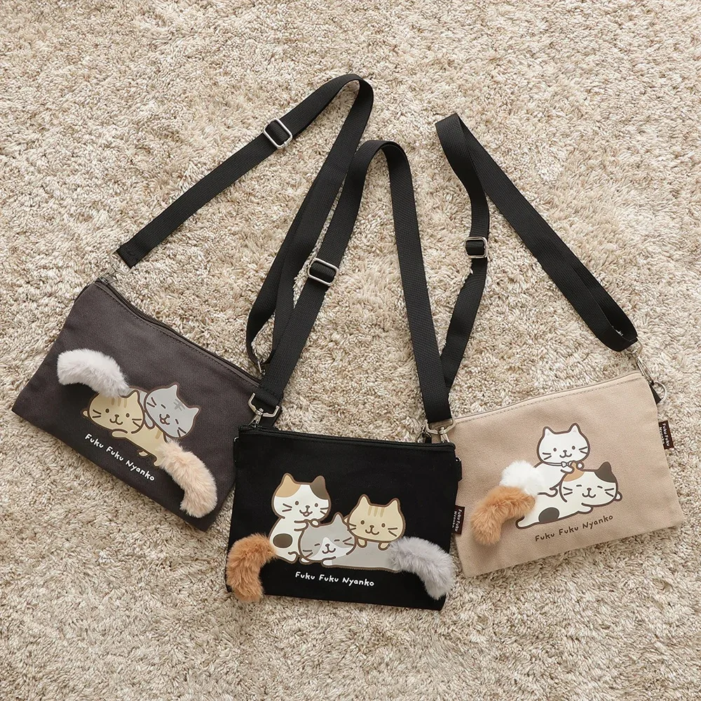 

Japanese three-flower cat wagging tail series cute messenger bag versatile student cartoon bag mobile phone bag women