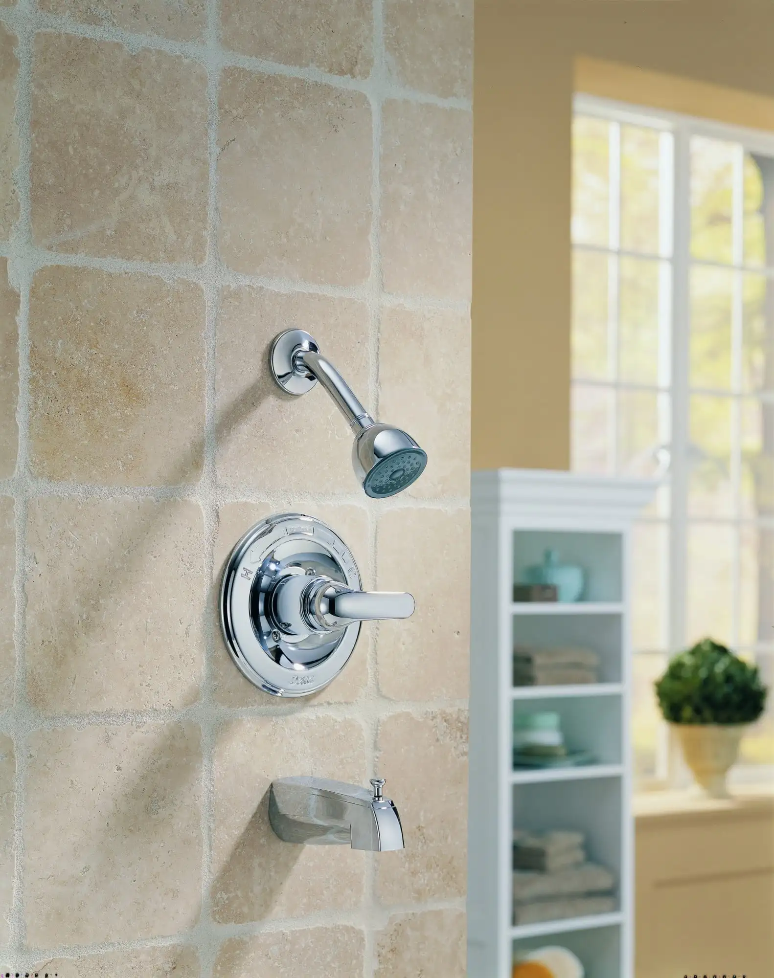 Classic Monitor®  Series Tub & Shower Trim in Stainless  Soft rubber spray holes allow you to touch lightly with your fingers