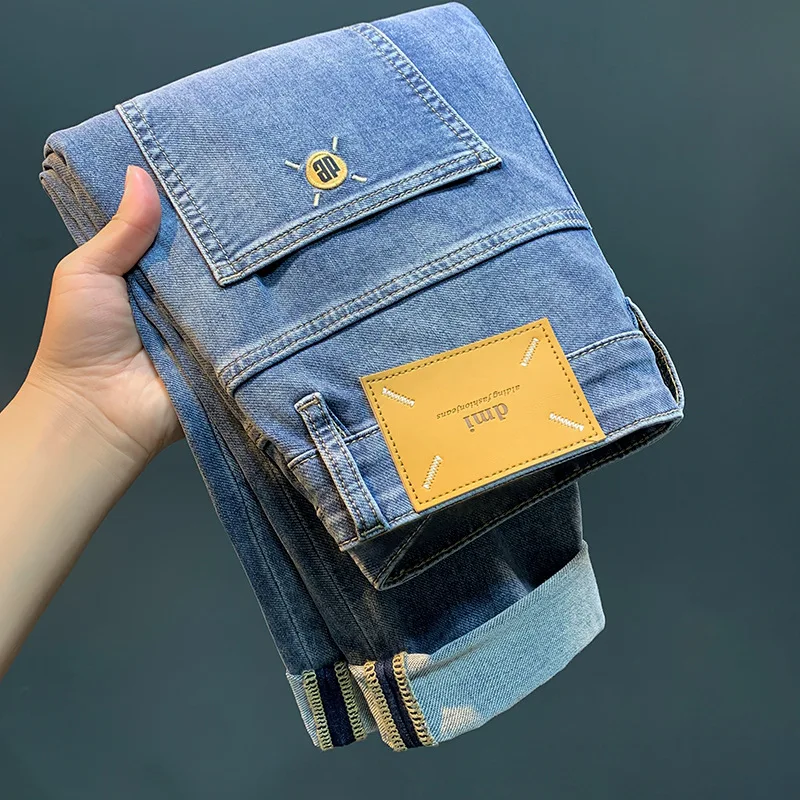 Celana jeans tipis pria, celana panjang pergelangan kaki biru muda Korea jalanan modis slim fit, celana kasual kelas atas