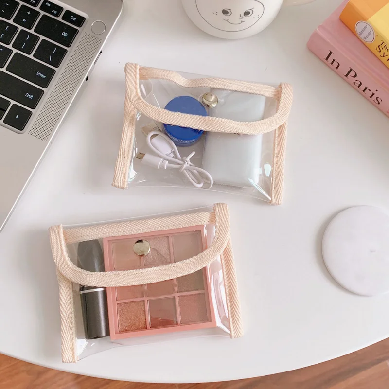Bolsa de almacenamiento de cosméticos pequeña transparente para mujer, bolso de Pvc a la moda para lápiz labial, llaves, auriculares electrónicos,