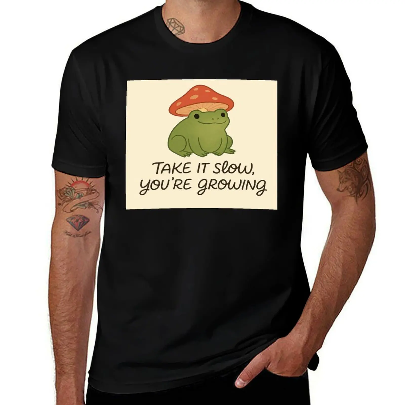

Cute Frog with Mushroom Hat – Inspirational Quote Take It Slow You’re Growing Cottagecore Design T-Shirt