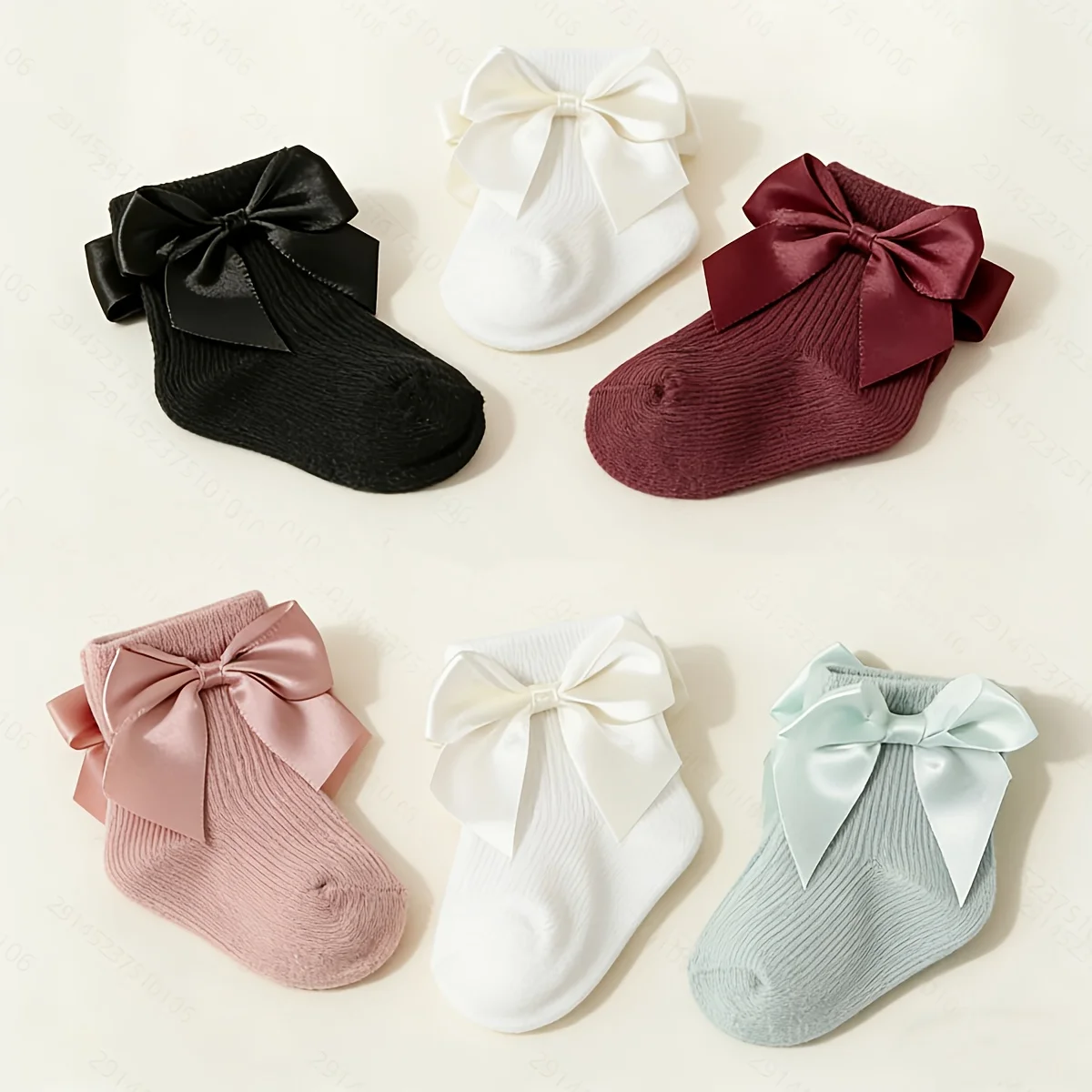 6 pairs of baby socks decorated with candy-colored bows in four seasons.