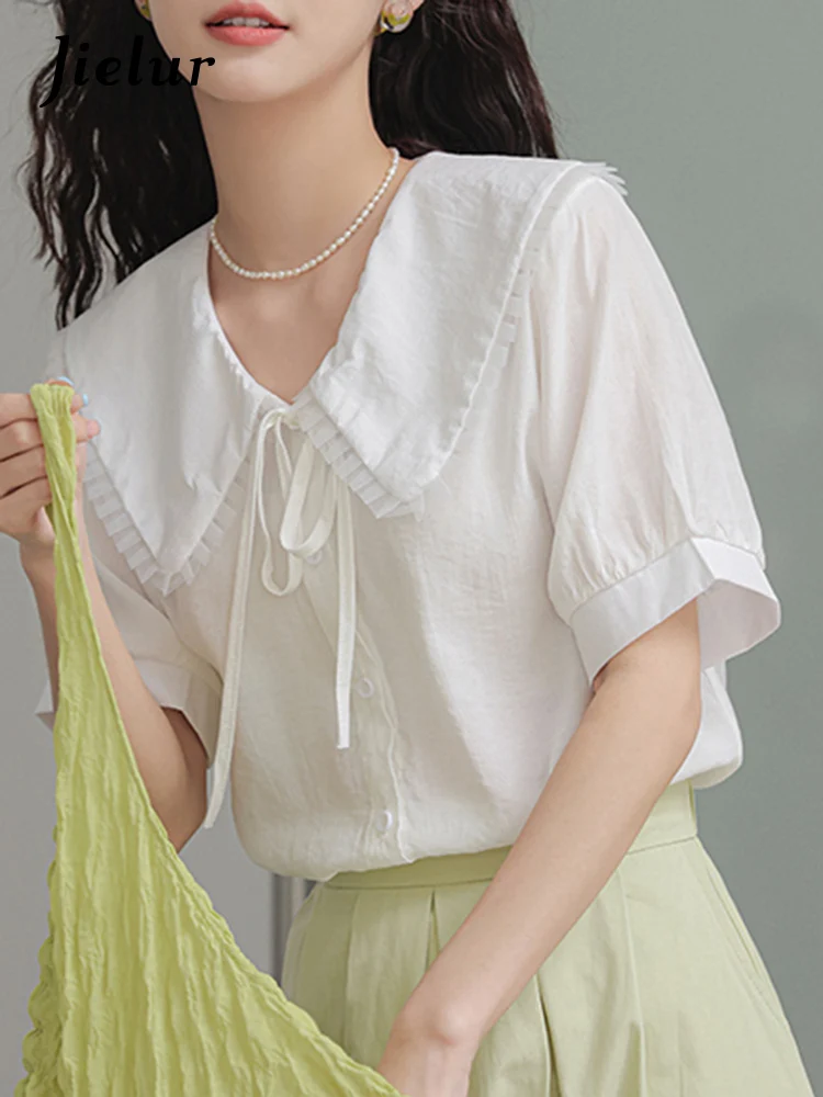 

Jielur Preppy Style White Ruffled Women Shirts Summer Solid Color Lace Up Casual Female Shirt Single Breasted Fashion Streetwear