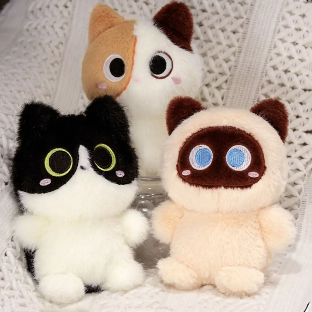 Siamesisches Kätzchen, orangefarbene Katze, Plüschpuppe, faule Kuh, Katze, Ragdoll, Katzenplüschtier, gefüllte, flauschige, heterochromatische Katzenpuppe