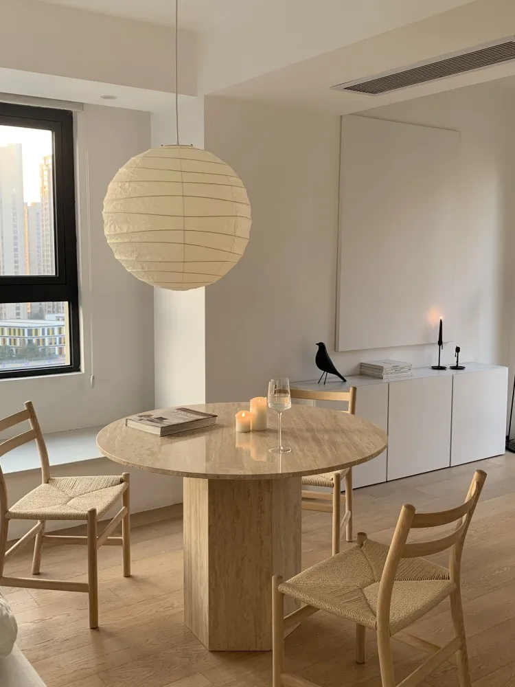 

Nordic simple travertine dining table modern designer home living room small apartment wabi-sabi French light luxury round