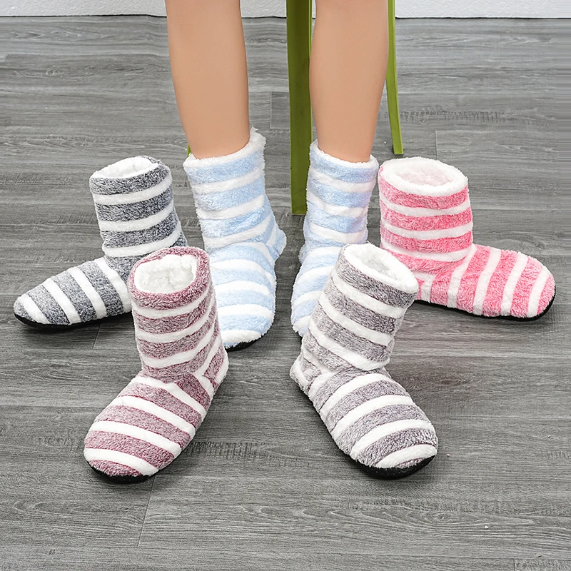 A pair of striped women\'s indoor floor shoes, socks, and winter household universal home shoes warm Plush Soft Botton slippers