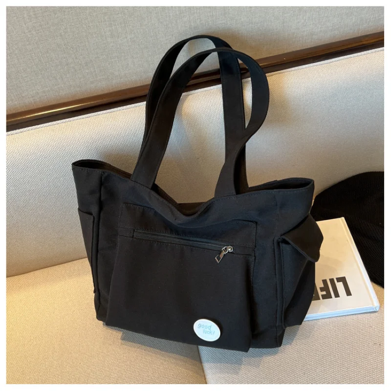 المرأة حقيبة كتف الموضة فئة سعة كبيرة طالب حمل حقيبة 2025 جديد قماش ركاب حمل حقيبة حقيبة نسائية