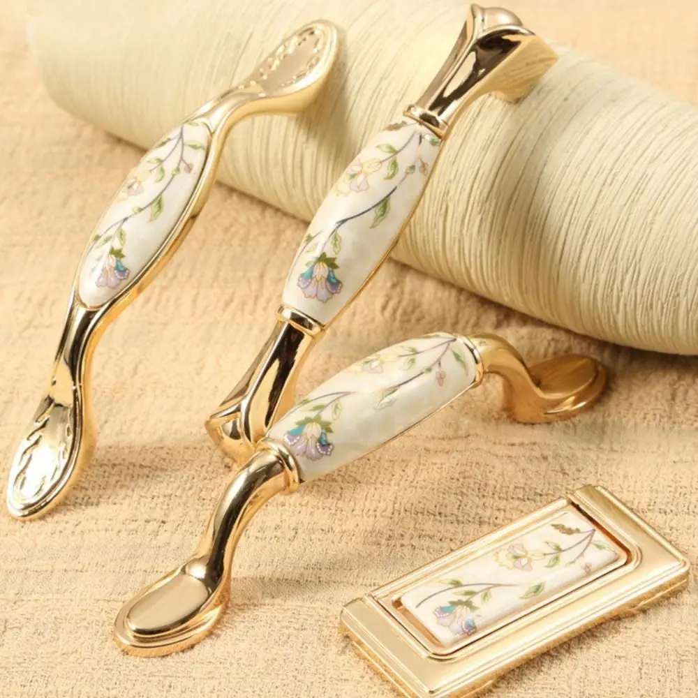 Tirador de armario de cocina dorado de aleación de Zinc, tiradores de cajón de cerámica de diseño elegante y lujoso, moderno europeo elegante