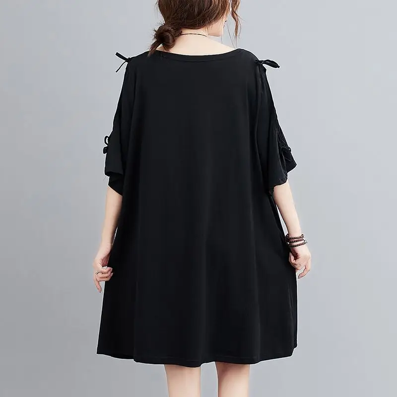 Extra große koreanische Damen version mittellanges, locker bedecktes Bauch-Rundhals-Kurzarm-T-Shirt-Kleid mit kurzen Ärmeln