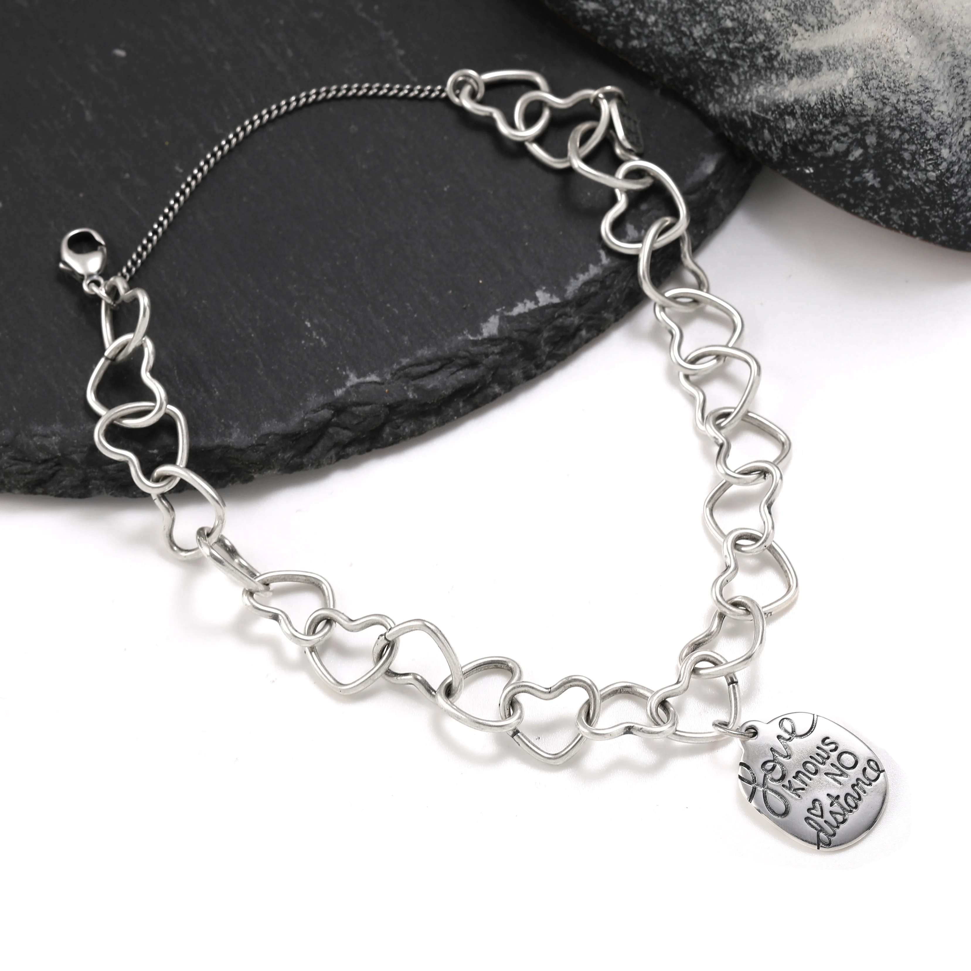 

Genuine 925 sterling silver Connected Hearts Charm Bracelet paired with "To and from the Moon" pendant