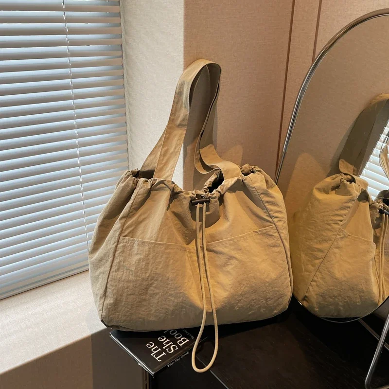 

2025 New Canvas Bag Women's Single Shoulder Big Bag Drawstring Multi Pocket Japanese Large Capacity Leisure Storage Travel Bag