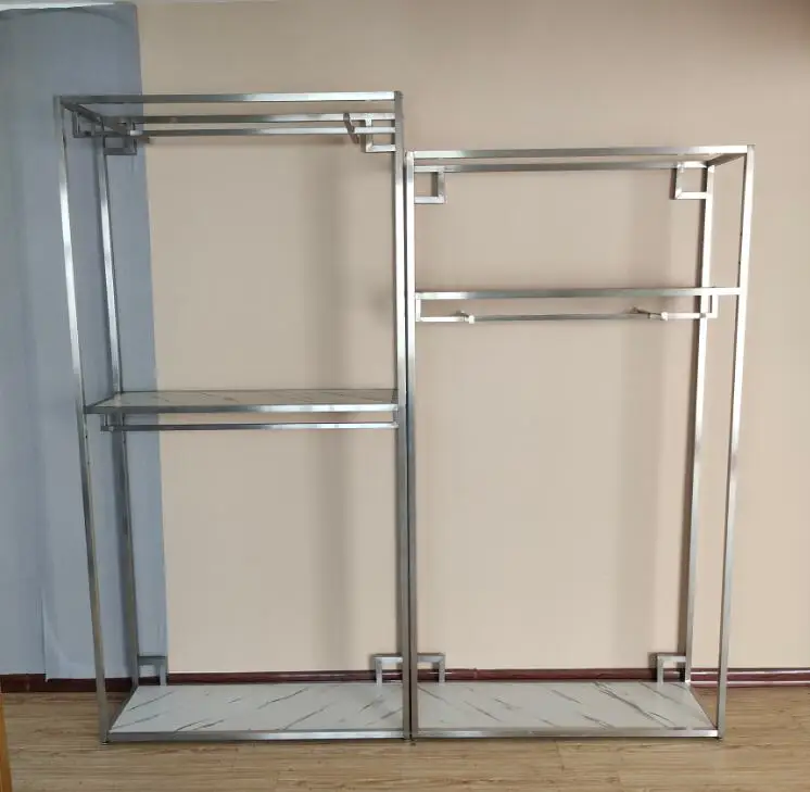 

Stainless steel brushed center island rack in boutique men's clothing store