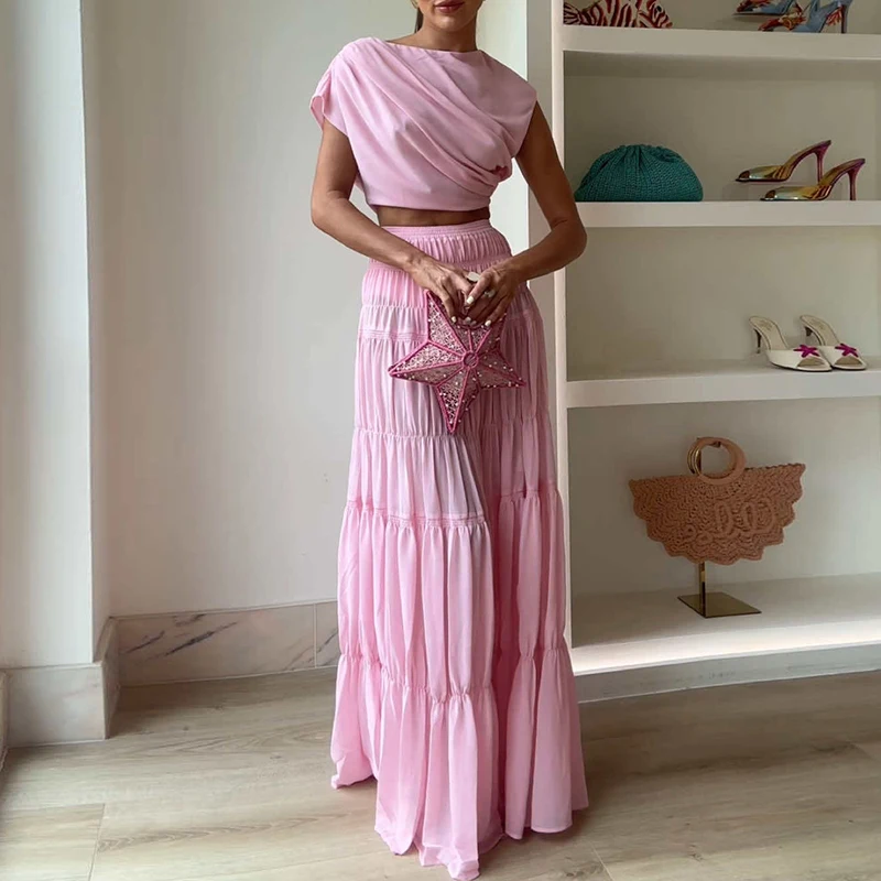 

Красивый розовый полый укороченный праздничный комплект из двух предметов Женский повседневный топ с круглым вырезом и длинная юбка Костюм Модный плиссированный костюм для вечеринок