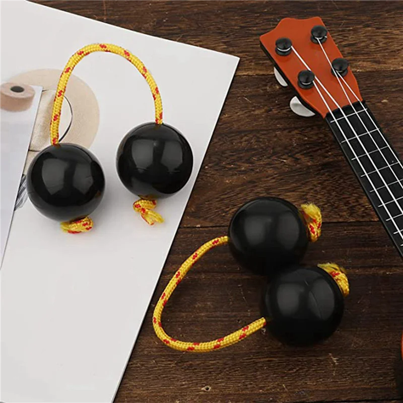 2 pares de bolas de ritmo, instrumentos de copa agitadora, sonajeros africanos clásicos, instrumentos de percusión manual (negro)