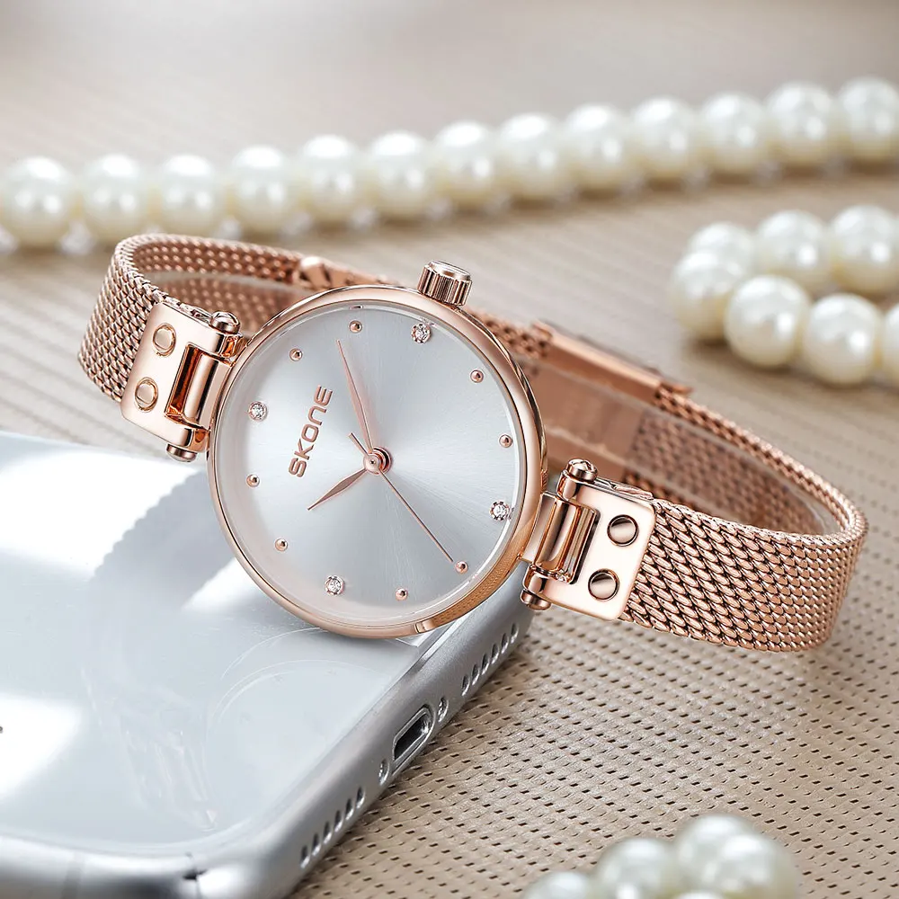 SKONE นาฬิกาผู้หญิง สไตล์เกาหลี Ins แฟชั่น เบา หรูหรา อินเทรนด์ นักเรียน นาฬิกาสายตาข่ายเหล็กอารมณ์เรียบง่าย