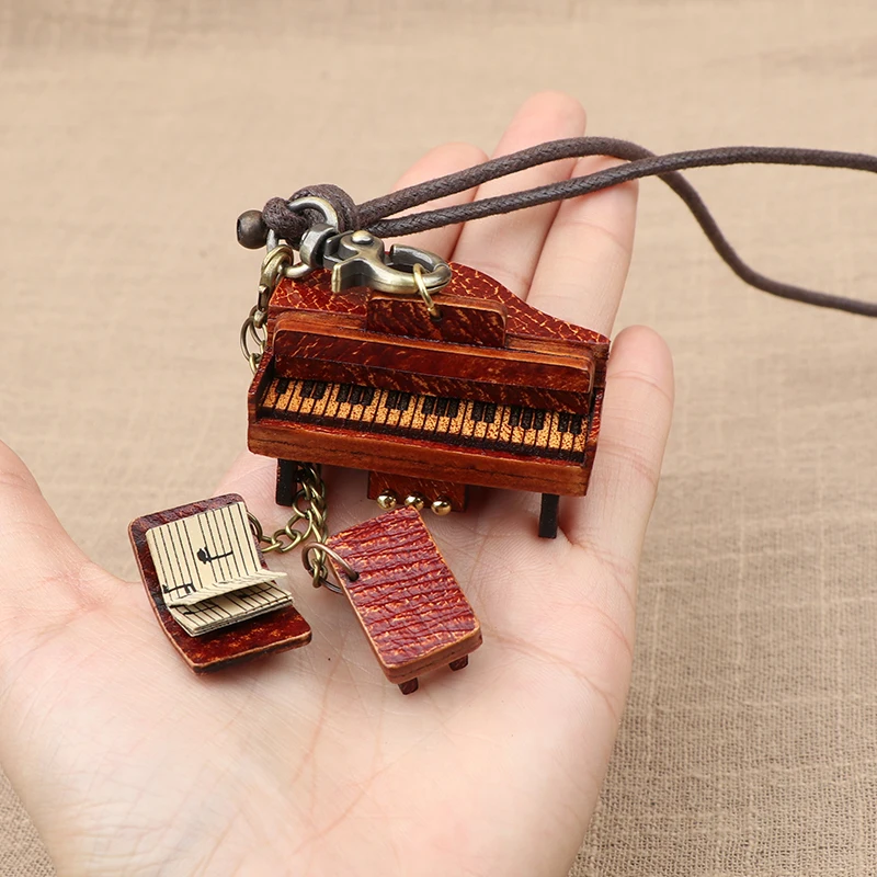 

Musical instrument piano bag pendant handmade genuine leather bag pendant sheet music ornament small gift souvenir