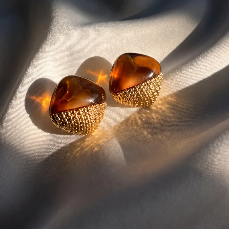 studs have a vintage vibe and a high-end feel, with unique earrings and gold color-block designs, making them versatile earrings