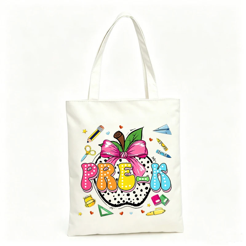 Preschool Kids' canvas tote bag with apple and school supplies graphic, ideal for daily school use and casual outings