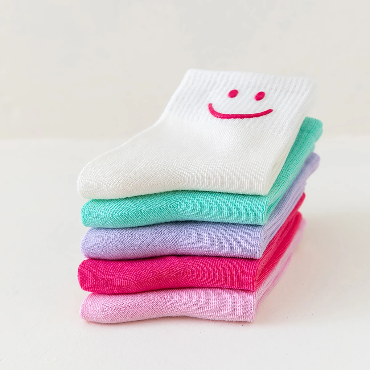 5 pairs of solid colored smiling face dopamine colored mid tube children\'s round socks, suitable for both men and women