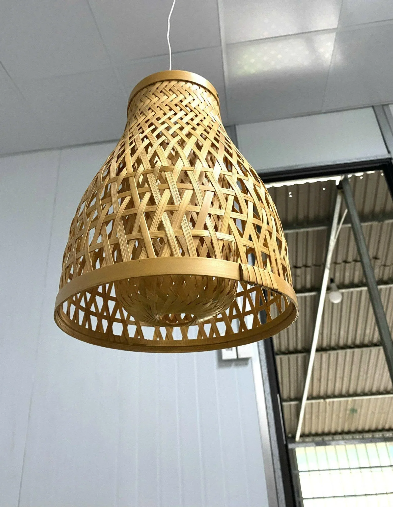 Handmade bamboo lamps with warm light add a unique natural touch to families seeking a sustainable decorative touch