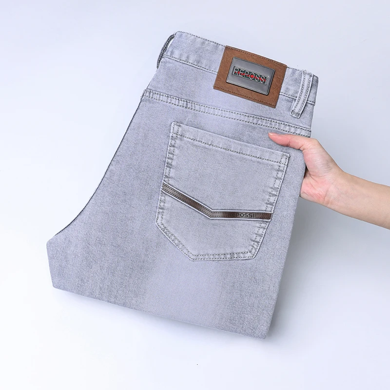 

2024 spring new light gray jeans men's simple slim fit light luxury fashion version of the elastic match leisure pants