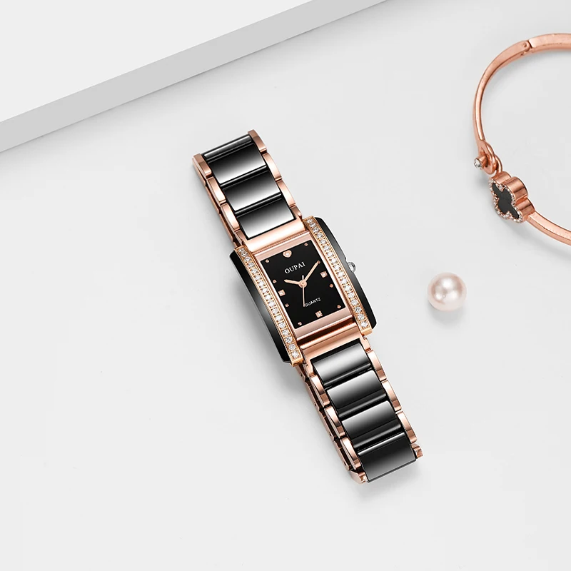 ساعة Oupai مستطيلة للنساء سوار أسود من حجر الراين كوارتز حركة عصرية وبسيطة ساعة يد رائعة مقاومة للماء