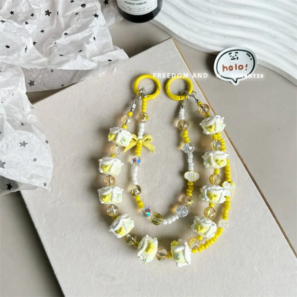 Lindo color crema correa para teléfono móvil Bowknot bolso con cuentas llavero colgante pintado a mano doble cadena teléfono encanto cuerda