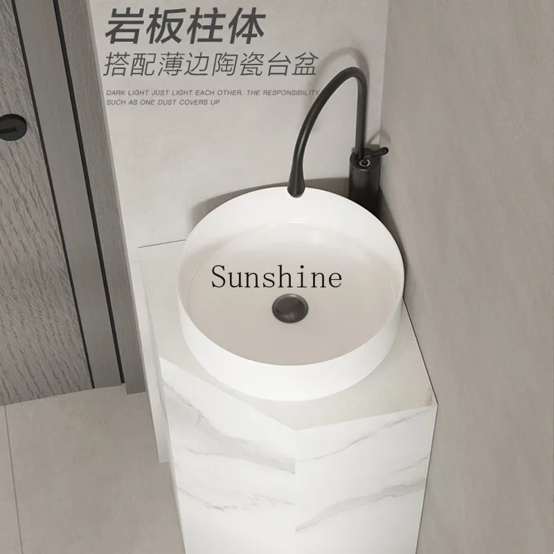 

Rock slab triangular column wash basin corner, integrated floor-to-ceiling bathroom balcony corner